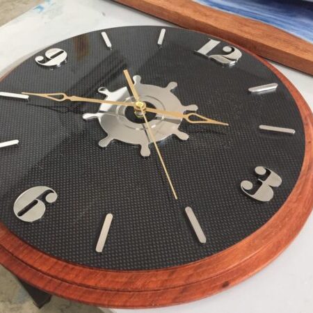 Carbon fiber wall clock combined with precious wood